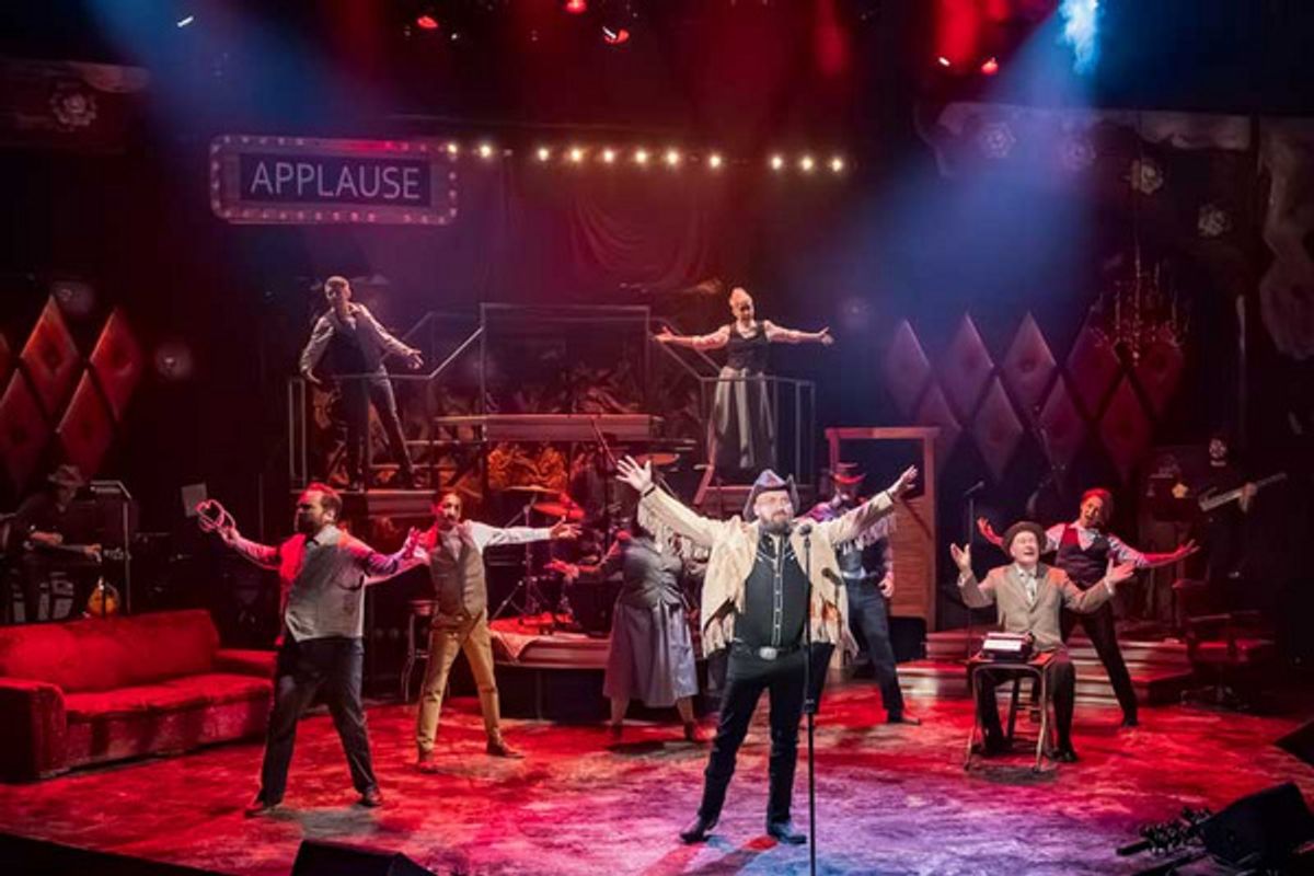 (center) Adam Qualls. (l-r) Randy Schmeling, Jordan Leggett,   Suzie Juul, Dane Stauffer, Jen Burleigh-Bentz, James Ramlet   (seated). back row: Sasha Andreev, Angela Timberman.  at 